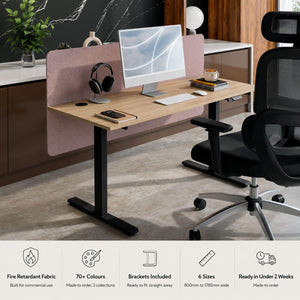 700mm sit stand desk top screen and modesty panel in pink fabric on a height adjustable desk showing features