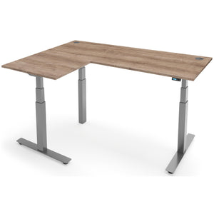Adjustable Height Corner Desk - Rize-Corner - Silver Frame - Grey Nebraska Oak Top - Studio Image