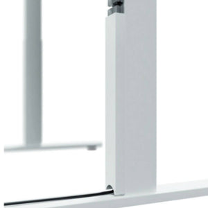 Close-up of the Leap magnetic cable protector routing a cable along a standing desk leg