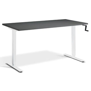 Crank height adjustable standing desk with a graphite desk top, white frame and hand crank