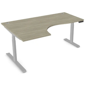 Curved standing desk with 1800mm x 1200mm arctic oak desk top, silver frame and left-hand return