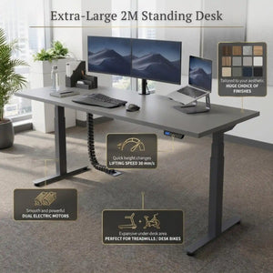 XL standing desk in office setting with annotations showing main benefits