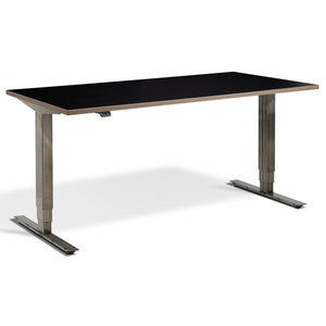 Industrial Standing Desk - Raw Steel Smyth - Black Ply Edge Top - Studio Image