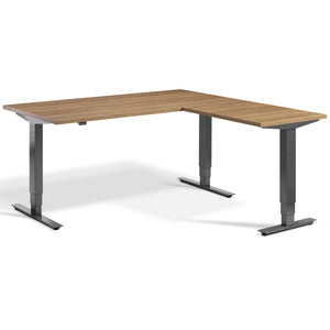 L Shaped Sit Stand Desk - Advance Corner - Dark Grey Frame - Brown Oak Top - Studio Image