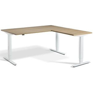 L Shaped Sit Stand Desk - Advance Corner - White Frame - Natural Oak Top - Studio Image