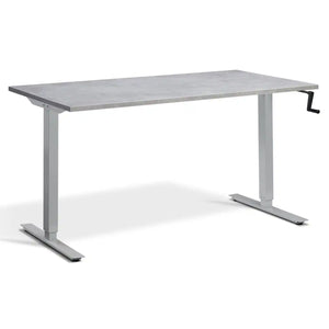 Manual crank standing desk with a light concrete desk top, silver frame and hand-operated crank
