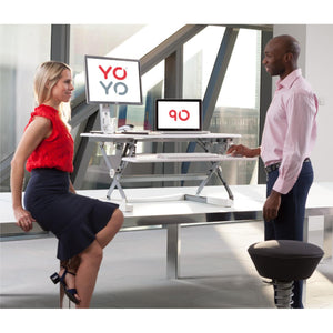 Yo Yo Desk 90 - Both Man and Woman using the White Variant of Desk 90
