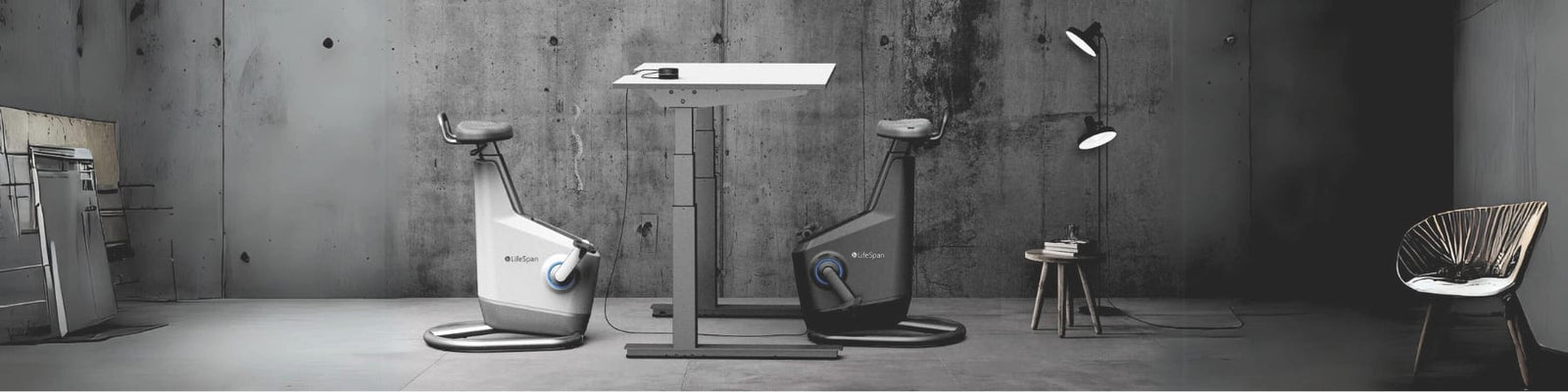 Ampera under desk bikes at a standing desk viewed from the side