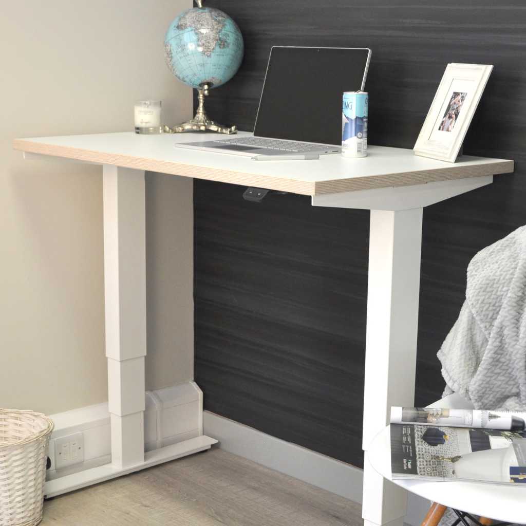 100cm white standing desk being used for home working - white frame with a white ply edge desk top