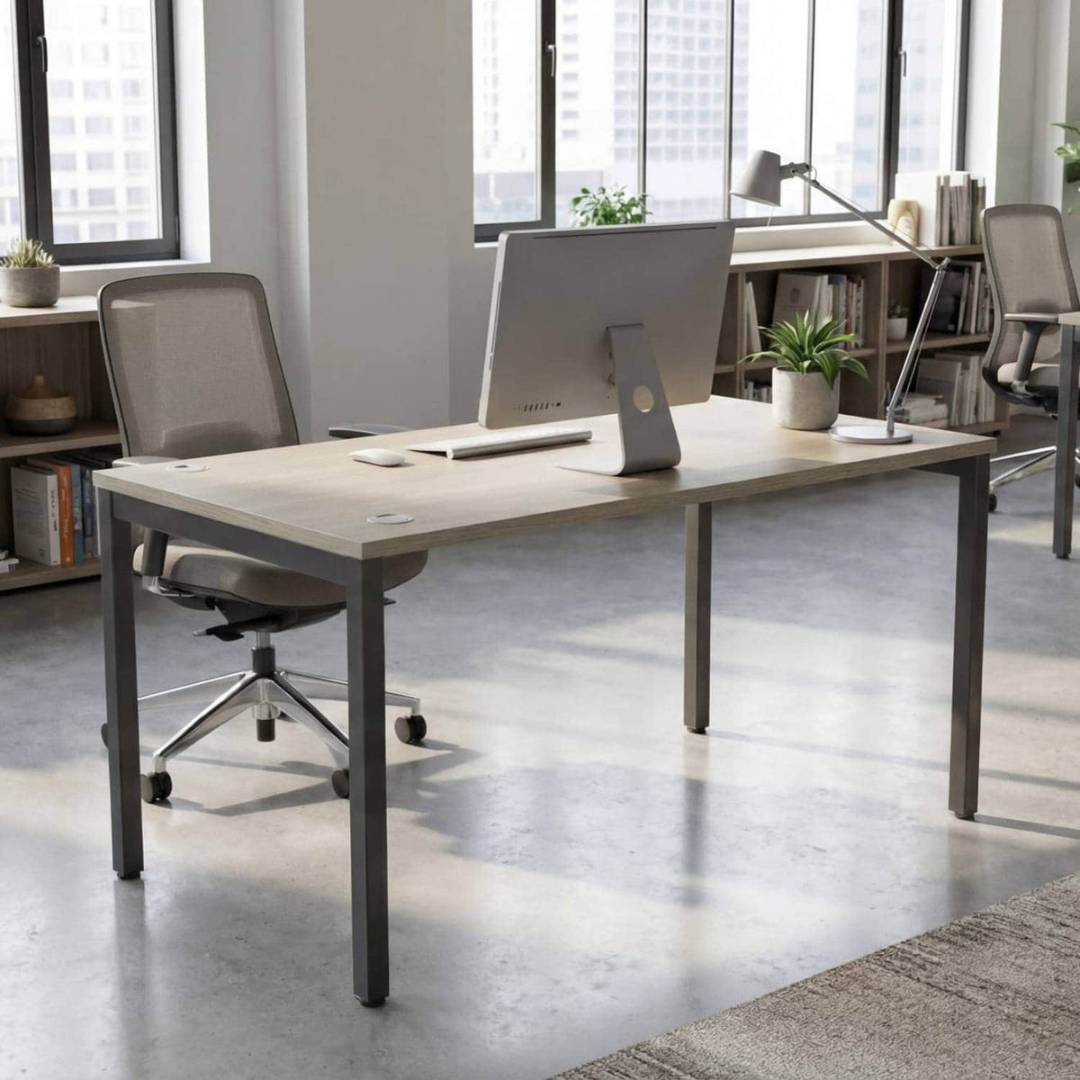 180cm desk with urban oak top and black frame in a modern office