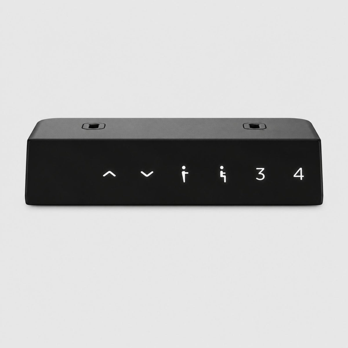 Close-up of black motorized desk legs memory handset