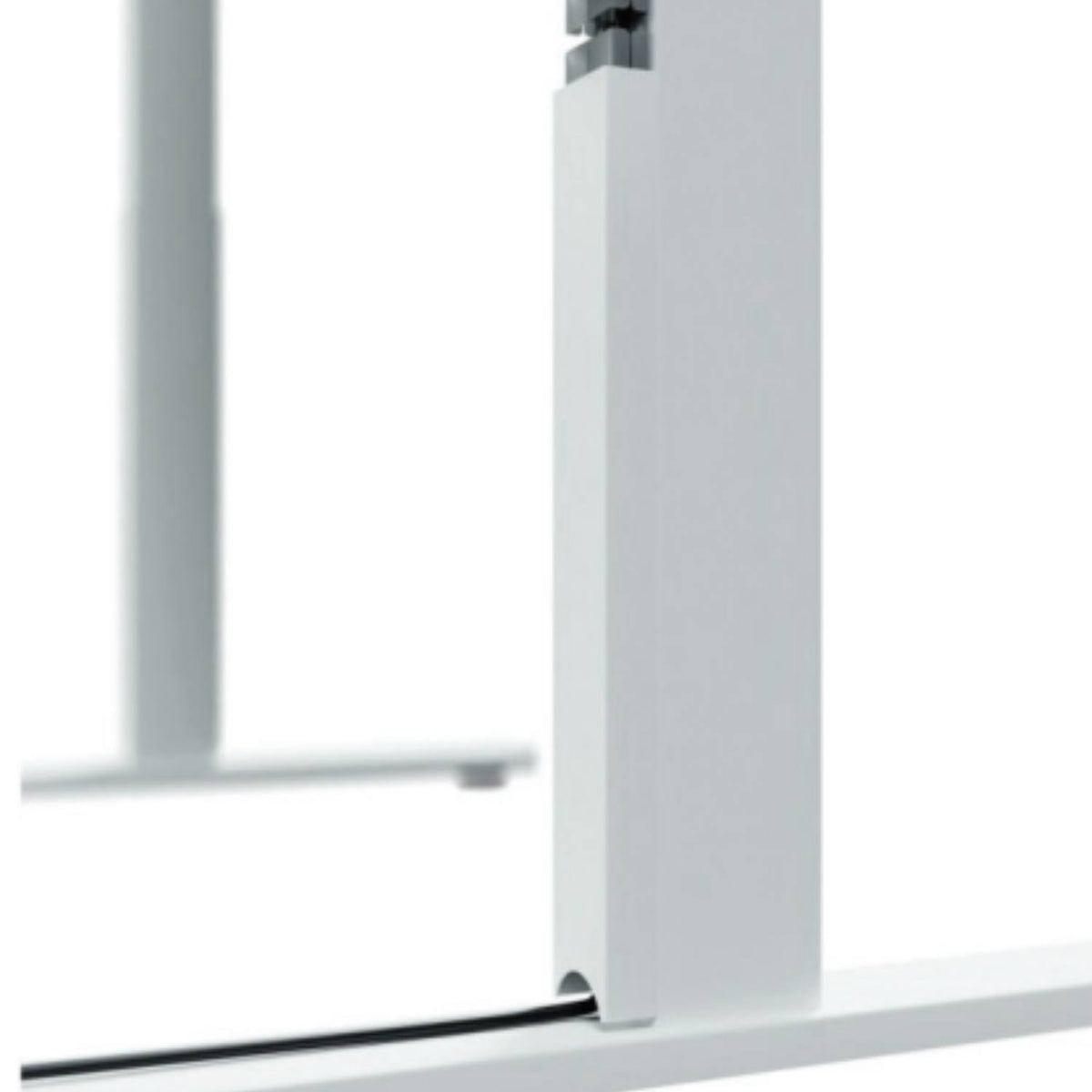 Close-up of the Leap magnetic cable protector routing a cable along a standing desk leg