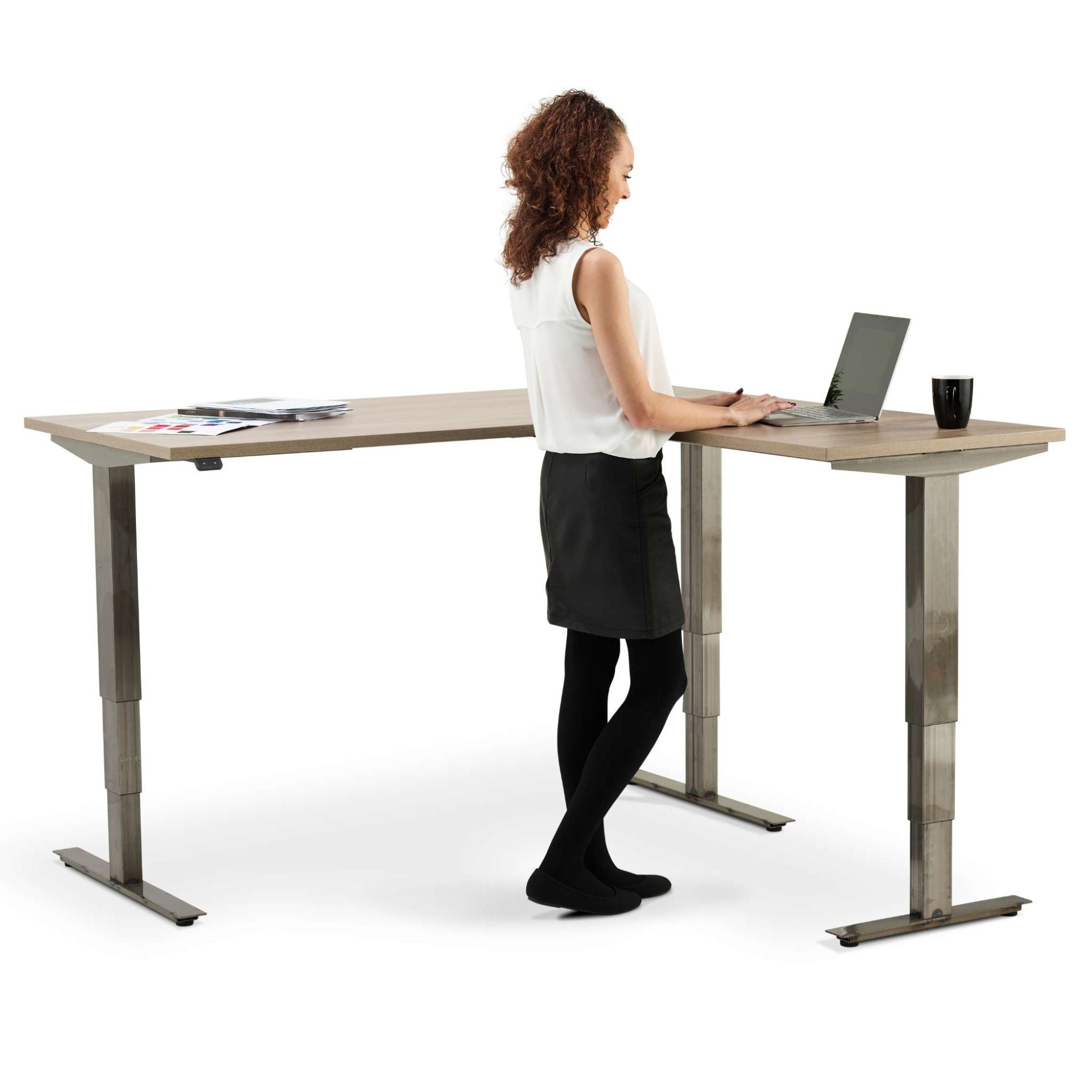 Corner Industrial Sit Stand Desk - Smyth - Woman Using the Desk