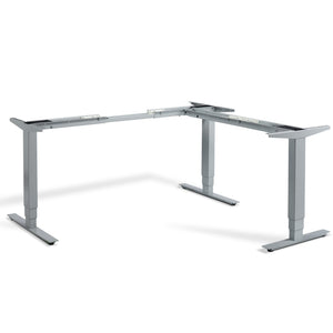 Corner standing desk frame in silver finish - the Lavoro Advance viewed from the front