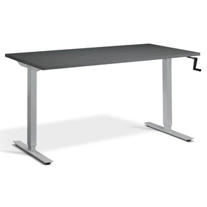 Crank height adjustable standing desk with a graphite desk top, silver frame and hand crank