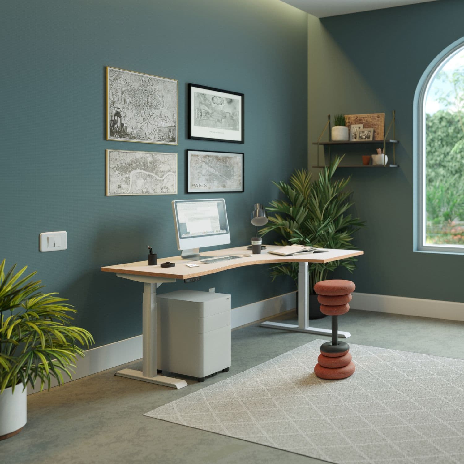 Curved sit stand desk with a light wood desk top and silver frame in a modern home office