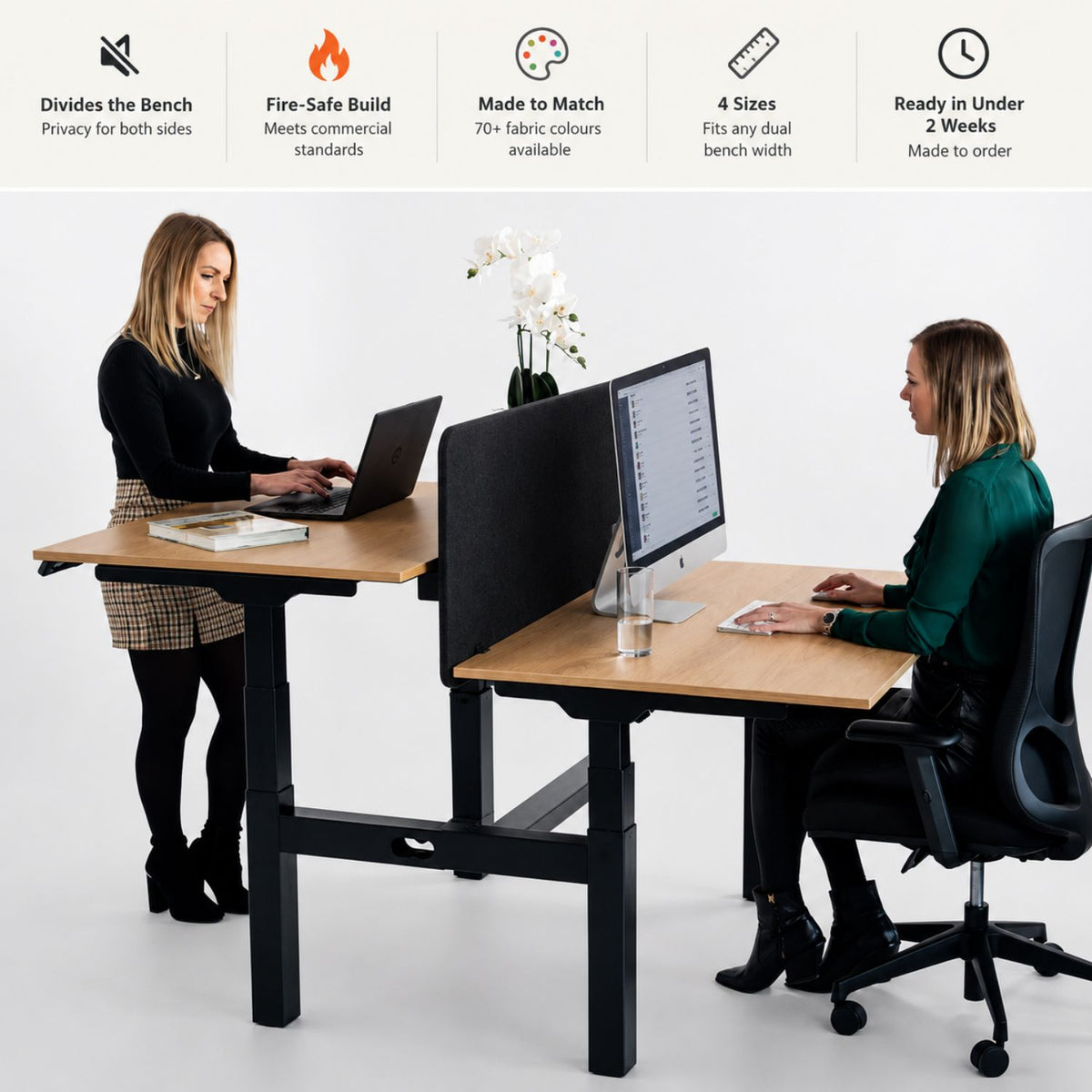 Desk top screen for sit stand dual bench desk shown between two users showing features