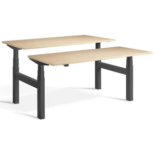Duo adjustable desk with dark grey frame and Maple desk tops