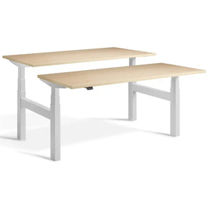 Duo adjustable desk with light grey frame and Maple desk tops