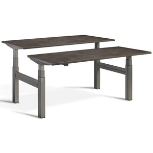 Duo adjustable desk with raw steel frame and Dark Concrete desk tops