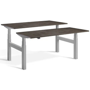 Duo adjustable desk with silver frame and Dark Concrete desk tops