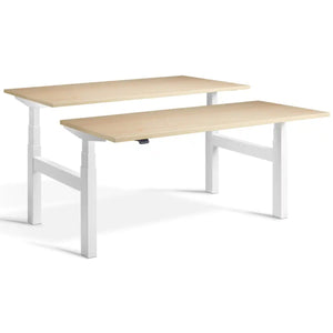 Duo adjustable desk with white frame and Maple desk tops