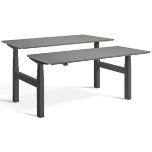 Duo height adjustable workstation with dark grey frame and Graphite desk tops