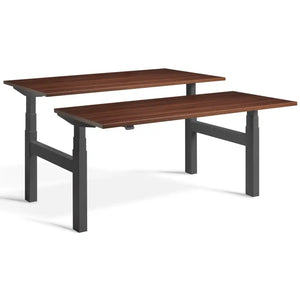 Duo height adjustable workstation with dark grey frame and Natural Dijon Walnut desk tops