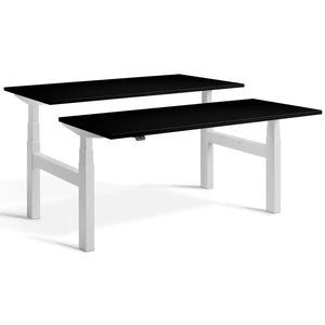 Duo height adjustable workstation with light grey frame and Black desk tops