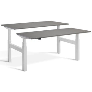 Duo height adjustable workstation with light grey frame and Graphite desk tops