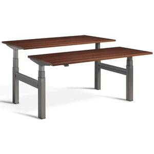 Duo height adjustable workstation with raw steel frame and Natural Dijon Walnut desk tops