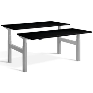 Duo height adjustable workstation with silver frame and Black desk tops