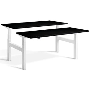 Duo height adjustable workstation with white frame and Black desk tops
