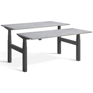 Duo sit stand desk with dark grey frame and Light Concrete desk tops