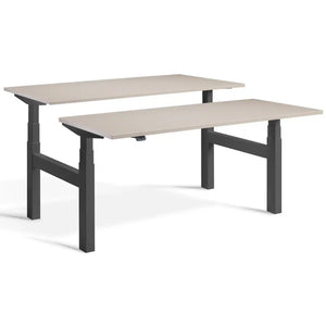 Duo sit stand desk with dark grey frame and Stone desk tops