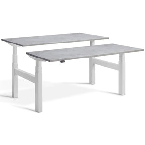 Duo sit stand desk with light grey frame and Light Concrete desk tops