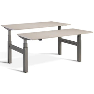 Duo sit stand desk with raw steel frame and Stone desk tops