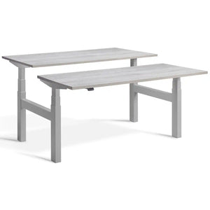 Duo sit stand desk with silver frame and Cascina Pine desk tops