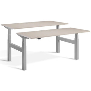 Duo sit stand desk with silver frame and Stone desk tops