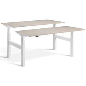 Duo sit stand desk with white frame and Stone desk tops