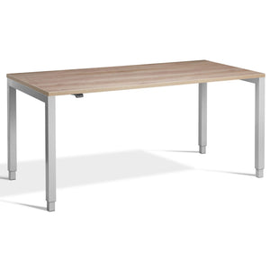 Four Leg Standing Desk - Rega - Silver Frame - Grey Nebraska Oak Top - Studio Image