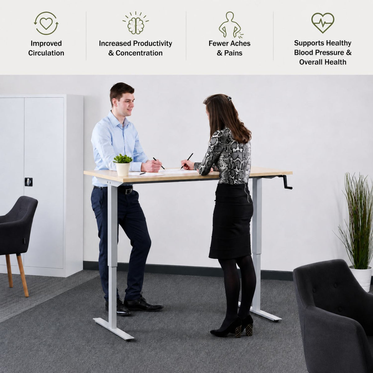 Hand crank sit stand desk used by two people with benefits for circulation, concentration, comfort and overall health