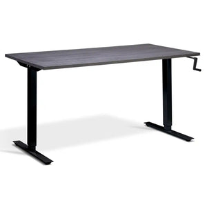 Hand crank standing desk with an anthracite Sherman oak desk top, black frame and manual height adjustment handle