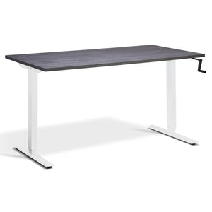 Hand crank standing desk with an anthracite Sherman oak desk top, white frame and manual height adjustment handle