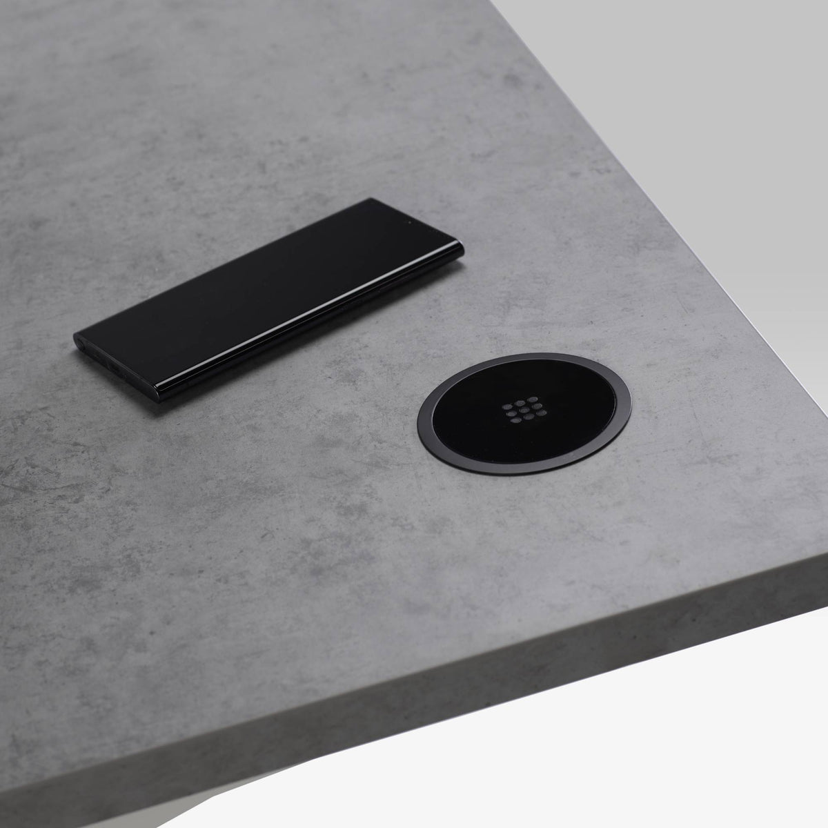 In Desk Wireless Charger - Showing the 80mm Matt Black Wireless Charger Installed at the Top of the Desk