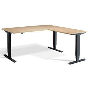 L-Shaped Sit-Stand Desk - Advance Corner - Black Frame - Maple Top - Studio Image