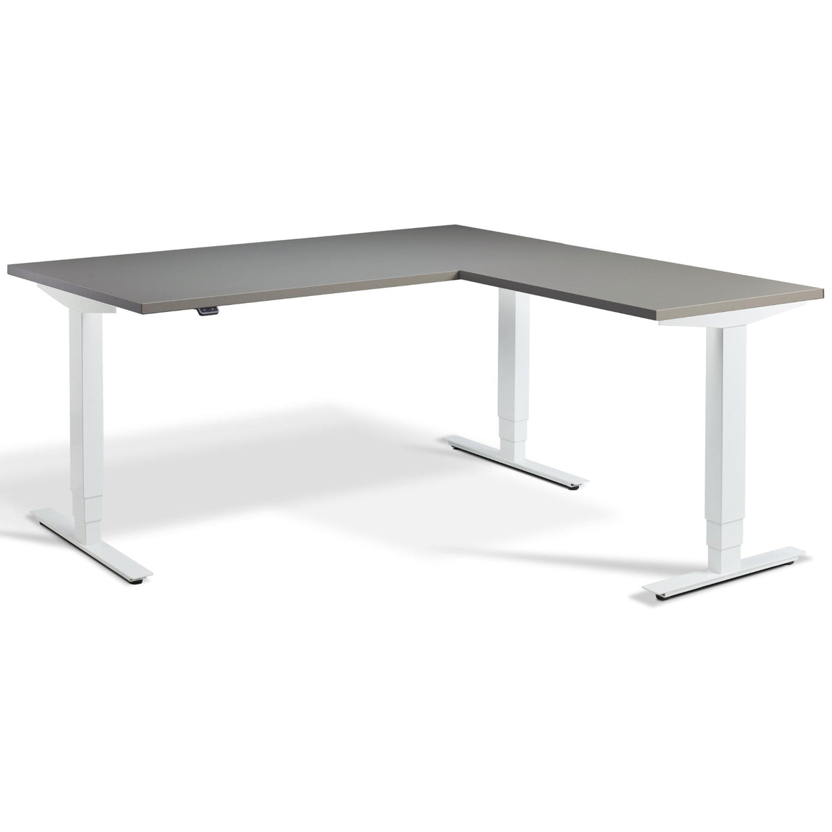 L Shaped Sit Stand Desk - Advance Corner - White Frame - Graphite Top - Studio Image