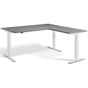 L Shaped Sit Stand Desk - Advance Corner - White Frame - Graphite Top - Studio Image