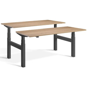 Lavoro dual standing desk with dark grey frame and Brown Oak desk tops