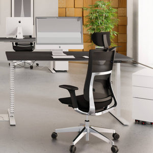 Leap cable spine fitted to a standing desk in a modern office setup